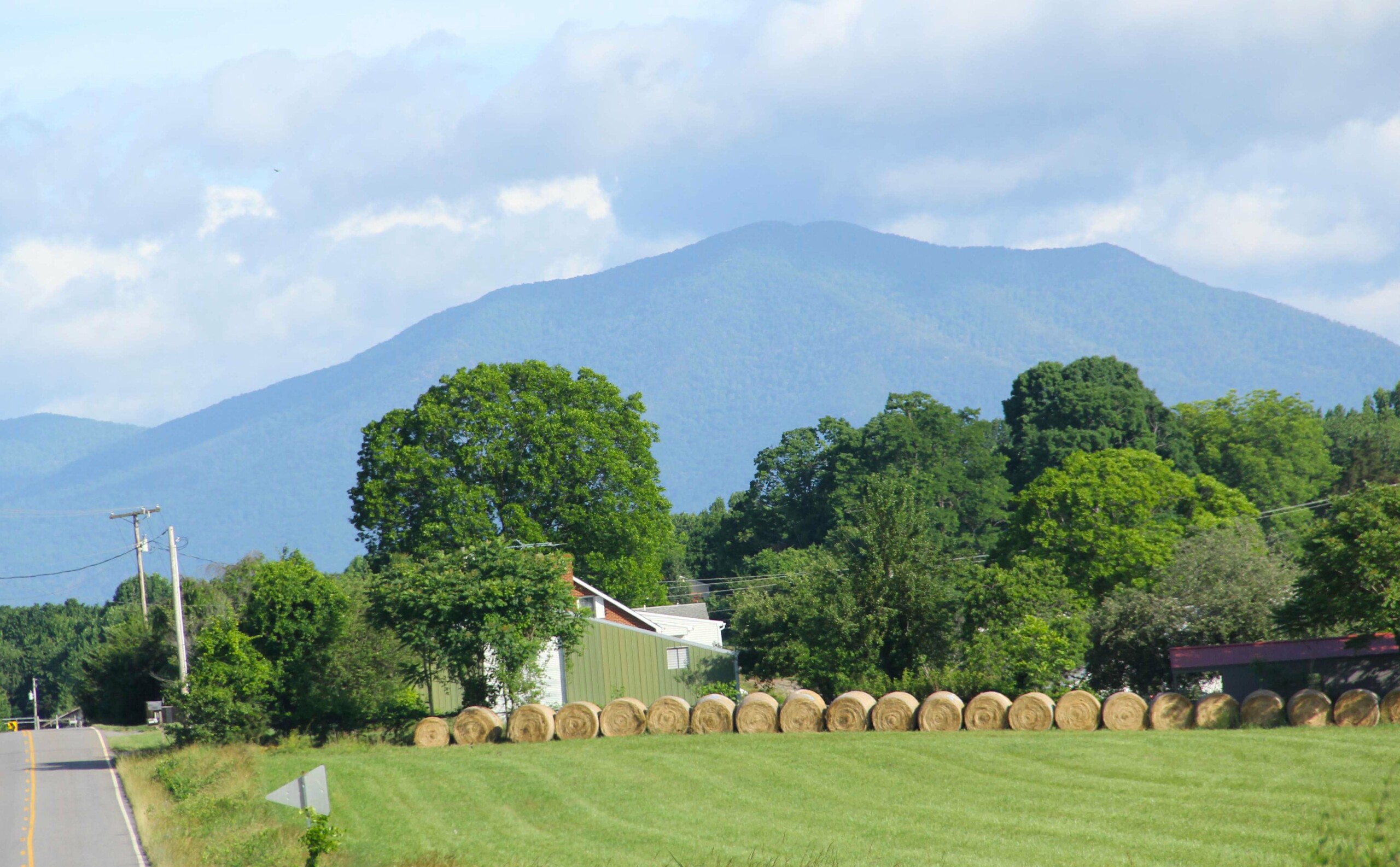 Farm Field with Bales of Hay